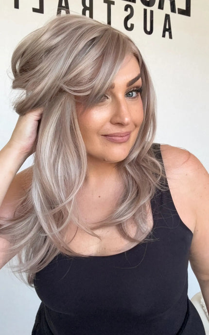 lilac toned, layered wig, middle part with curtain bangs and layers.