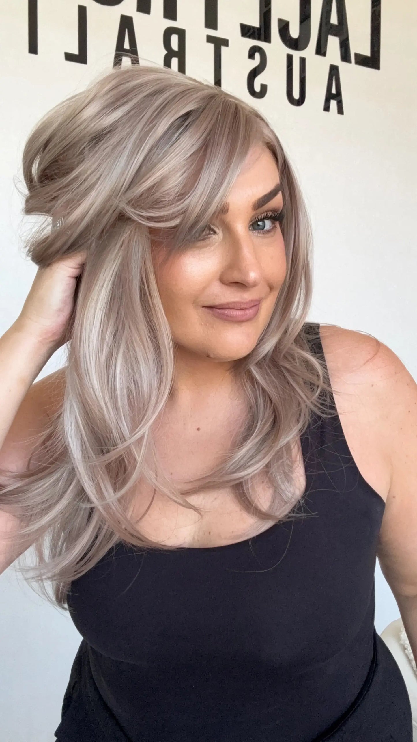 lilac toned, layered wig, middle part with curtain bangs and layers.