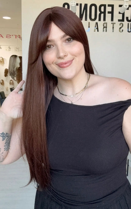 long length burgundy coloured heat safe synthetic wig. 