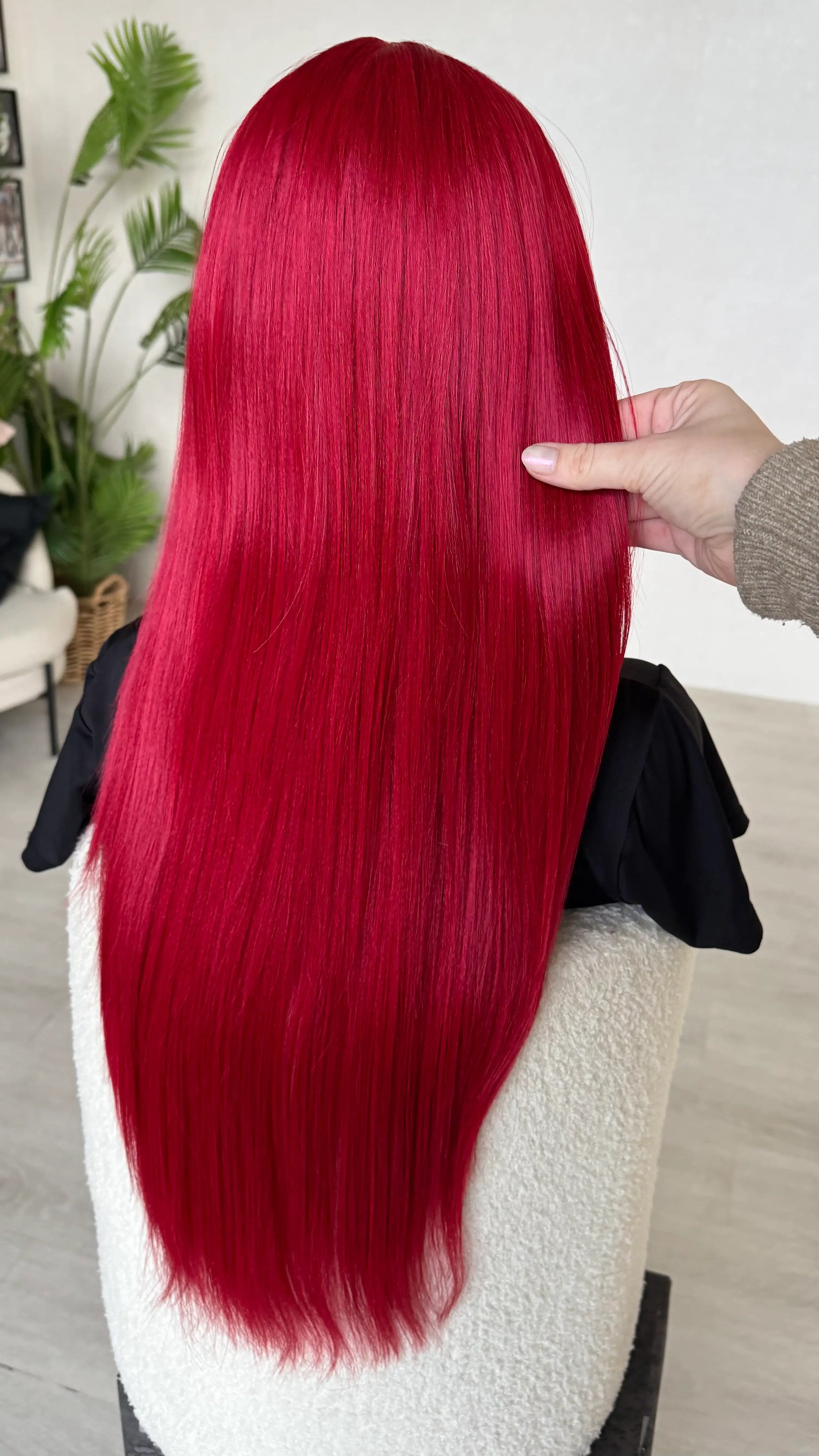 back of the long red hair, holding hair in hand, 26 inch length, heat safe hair. wigs australia.