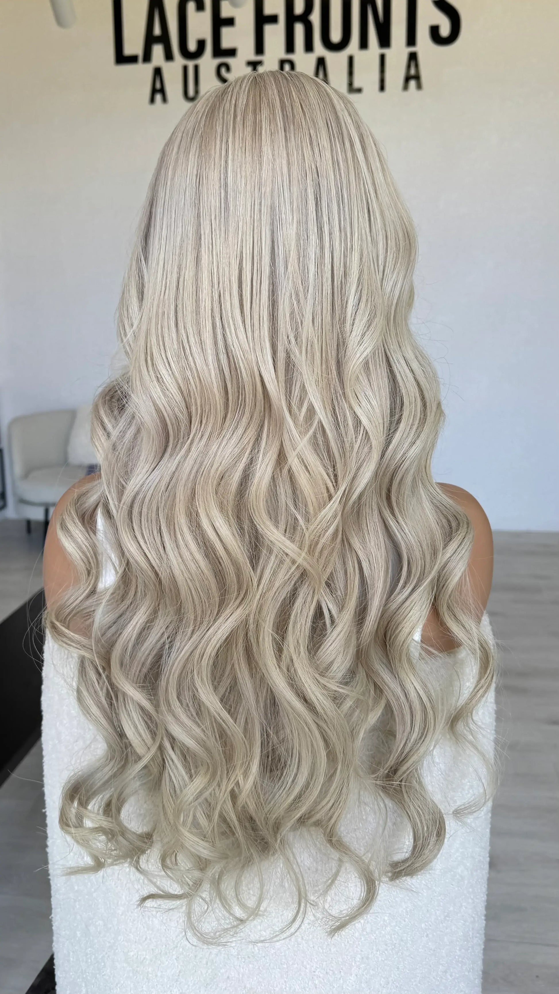 human hair lacefront wig, platinum blonde hair, curled, 26 inch length hair.