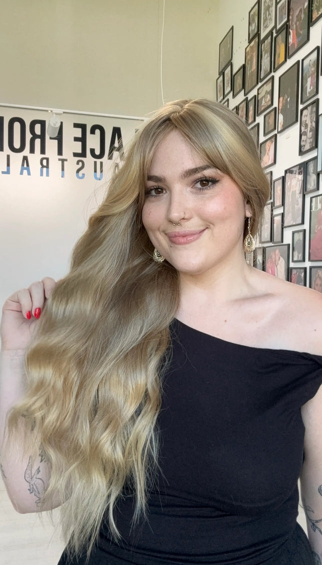 heat safe long wavy blonde hair synthetic wig australia, middle part with fringe.