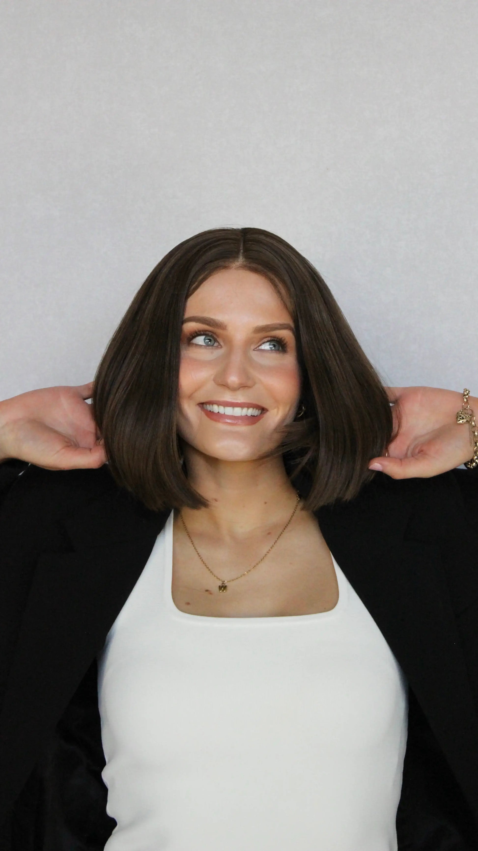 synthetic heat safe brunette bob, lacefront 12 inch length. middle part with baby hairs.