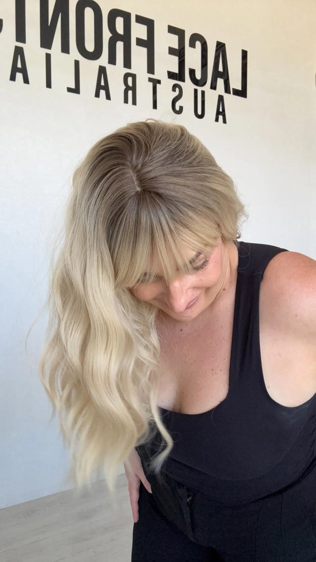 fringe synthetic topper heat safe wavy blonde hair.