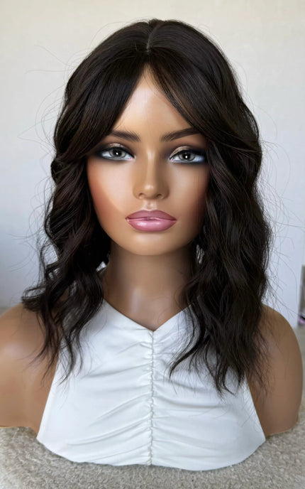 synthetic topper, middle part fringe parted to the side,