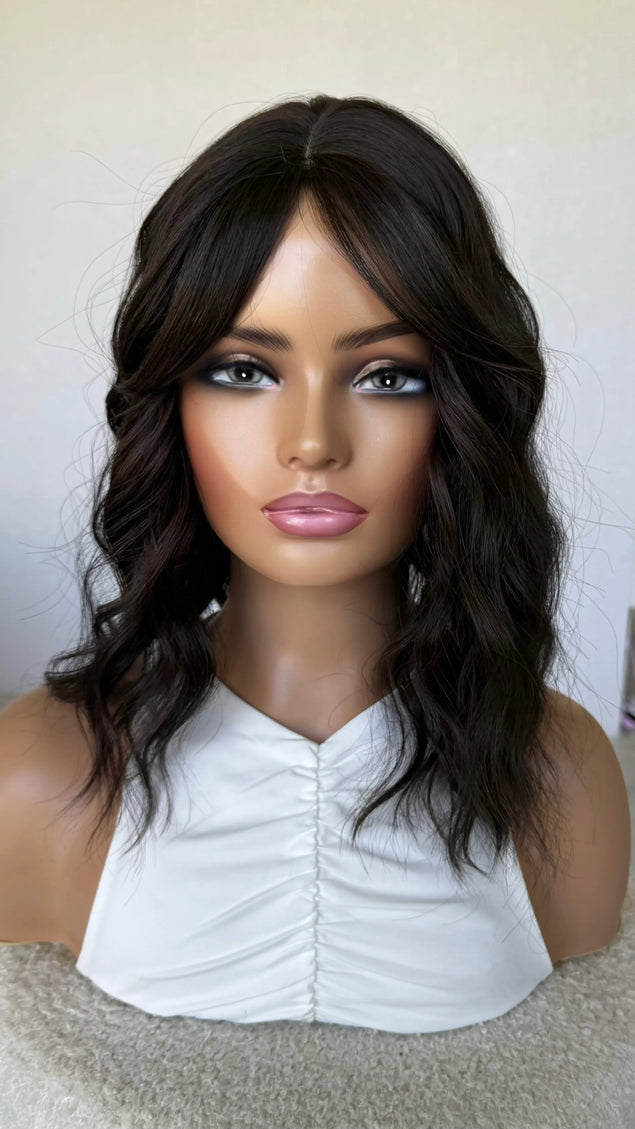 synthetic topper, middle part fringe parted to the side,