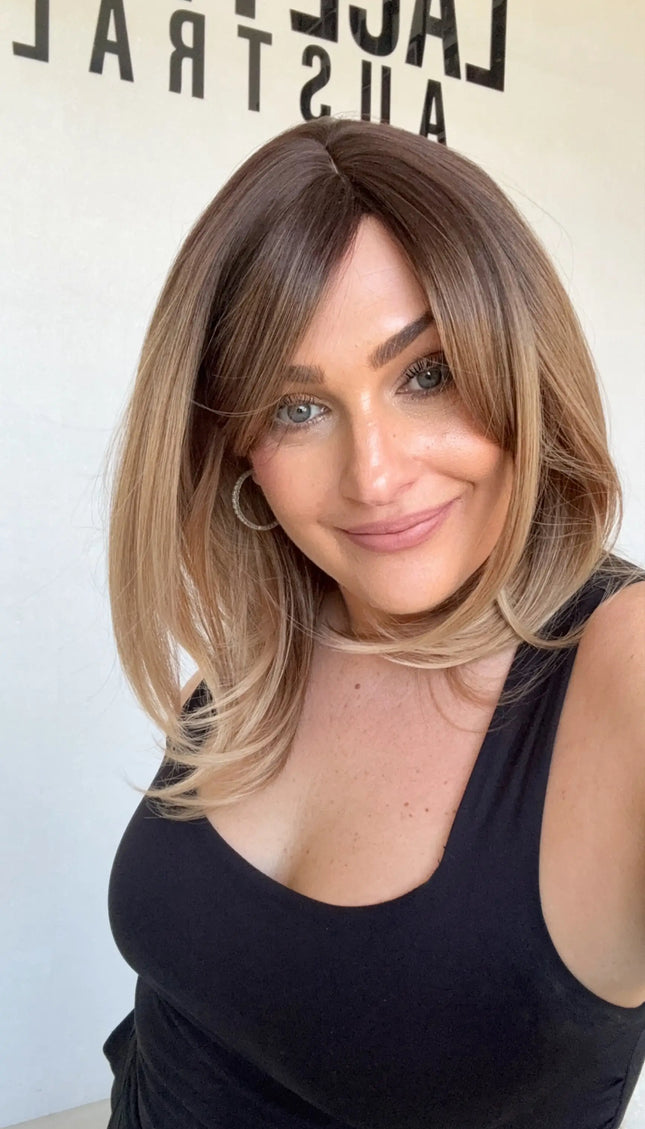 heat safe and glueless synthetic, golden brunette ombre to blonde ends, layered hair.