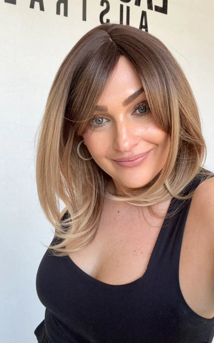 heat safe and glueless synthetic, golden brunette ombre to blonde ends, layered hair.