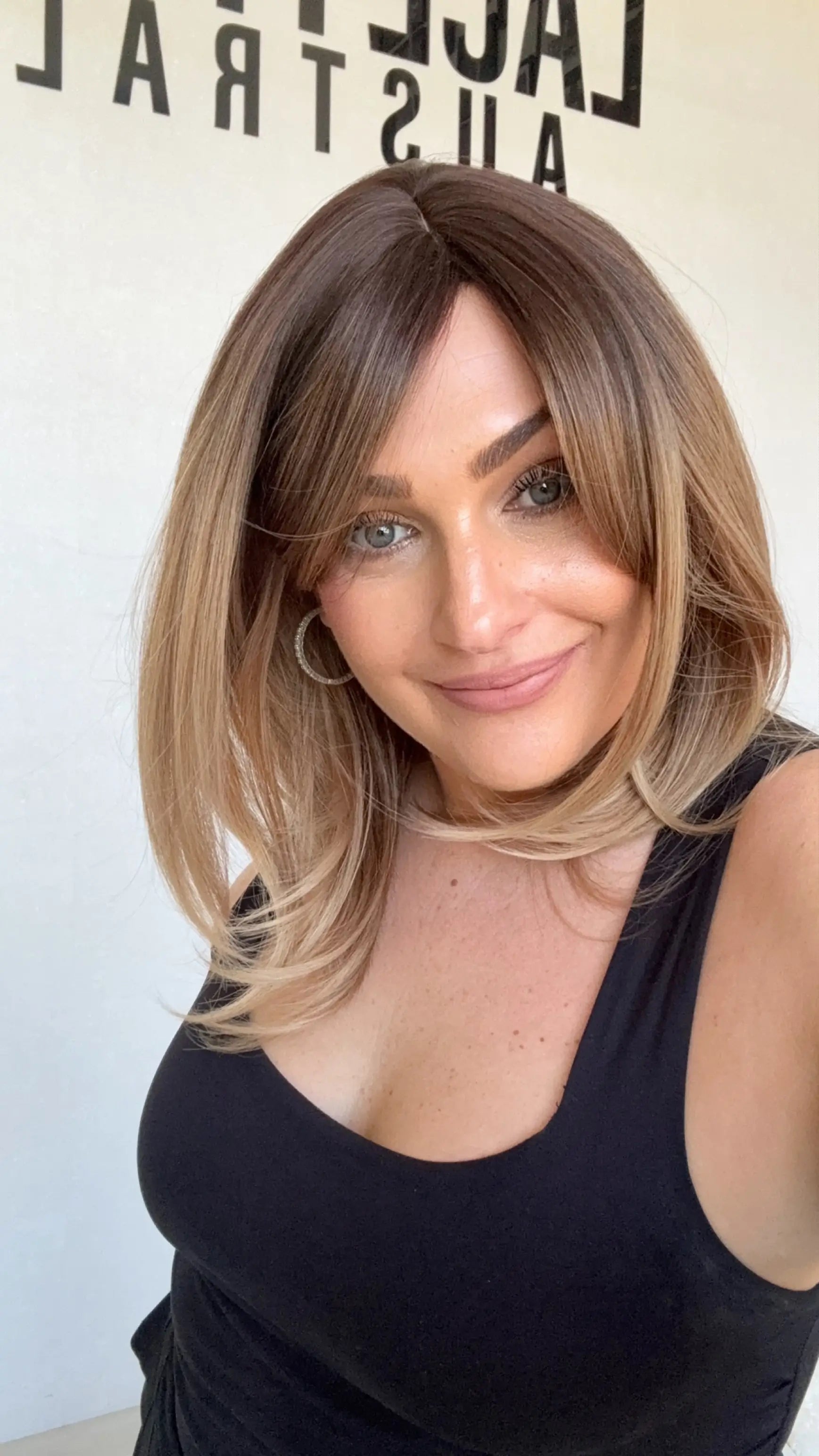 heat safe and glueless synthetic, golden brunette ombre to blonde ends, layered hair.