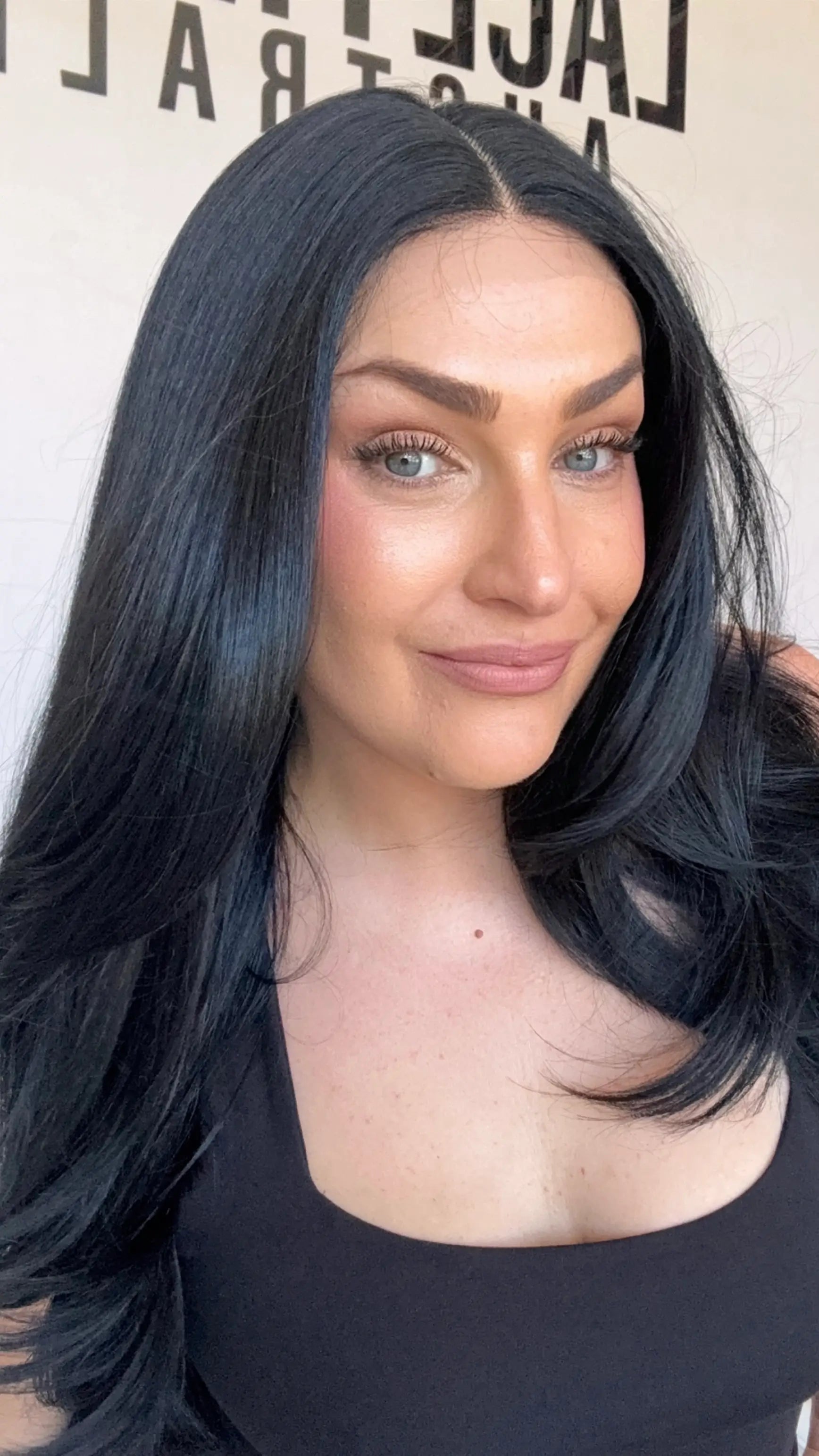 black hair lace synthetic wig, middle part with layers.