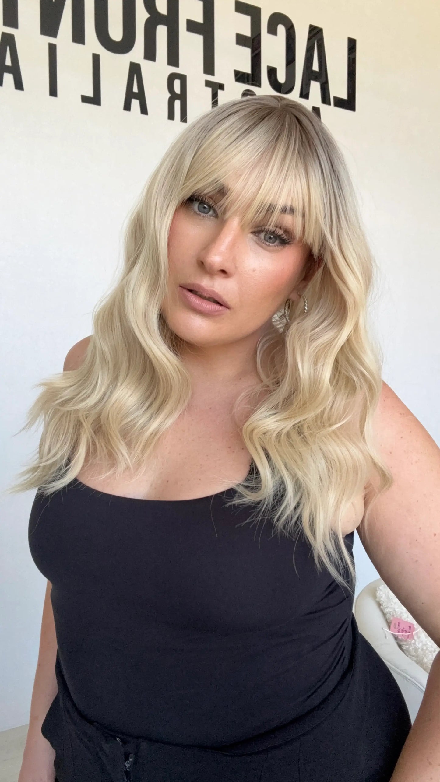 wavy blonde hair with middle part and darker root, long blonde heat safe synthetic australia.