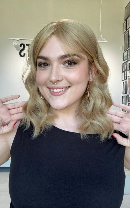 honey blonde hair middle part. heat safe topper with fringe. glueless cap