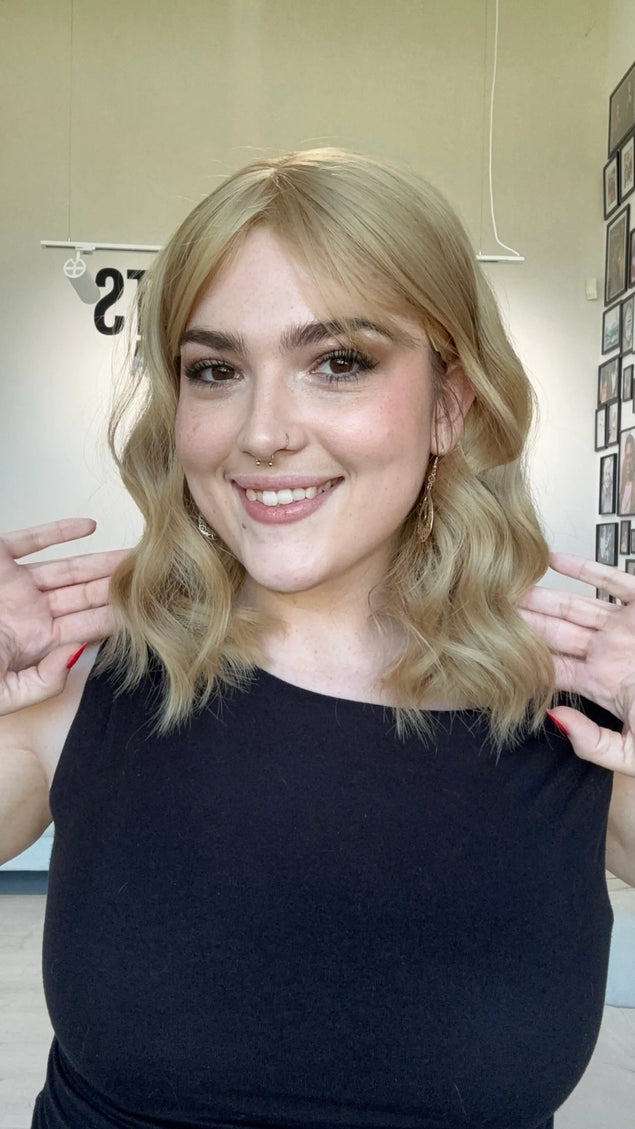 honey blonde hair middle part. heat safe topper with fringe. glueless cap