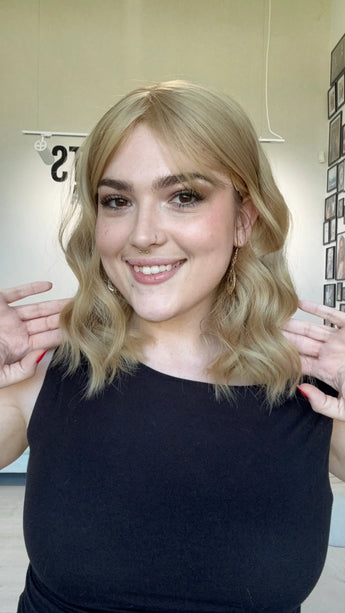 honey blonde hair middle part. heat safe topper with fringe. glueless cap