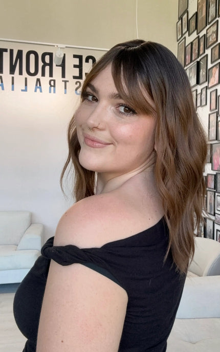 wavy dark brown hair with fringe. heat safe glueless synthetic topper.