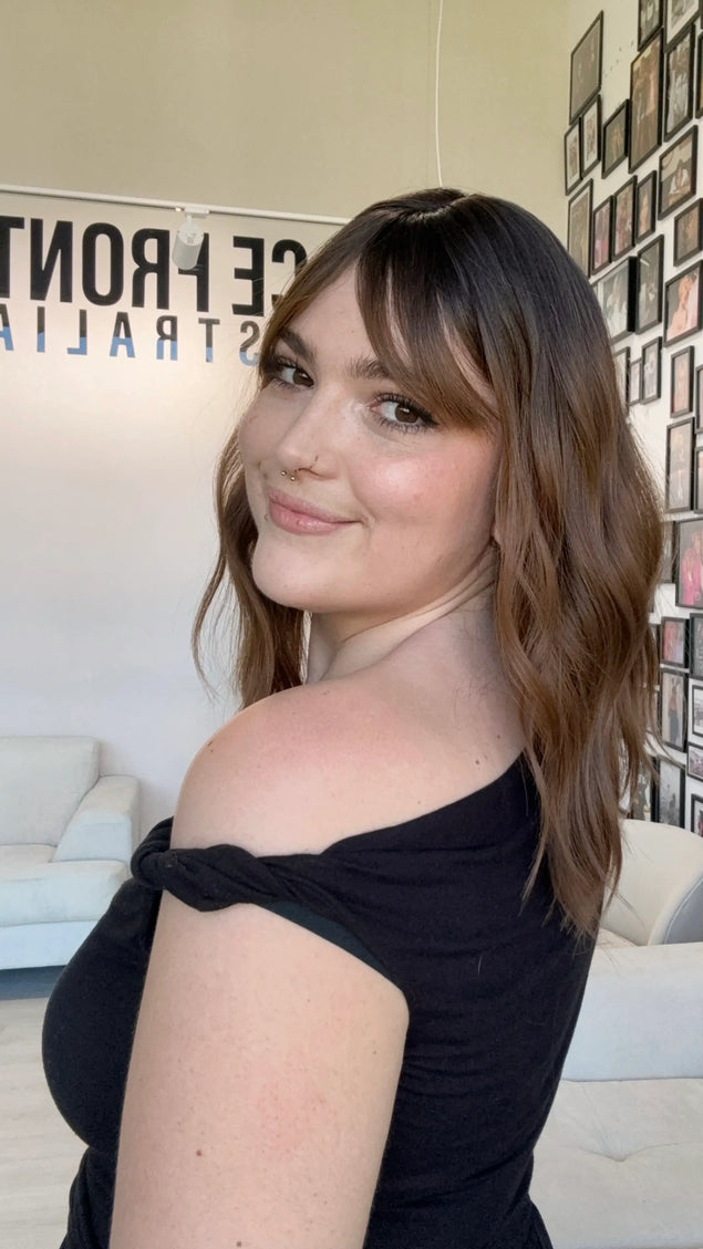 wavy dark brown hair with fringe. heat safe glueless synthetic topper.