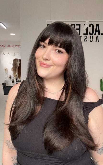 Highlighted dark brown fringe synthetic with heat safe hair and a glueless cap for easy beginner wear.