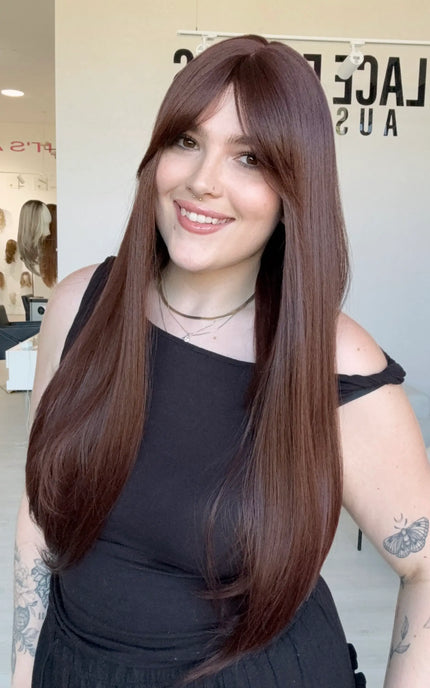 a realistic long length red brunette synthetic wig for hairloss, based in australia.