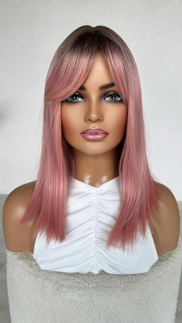 heat safe topper pink hair with dark root.