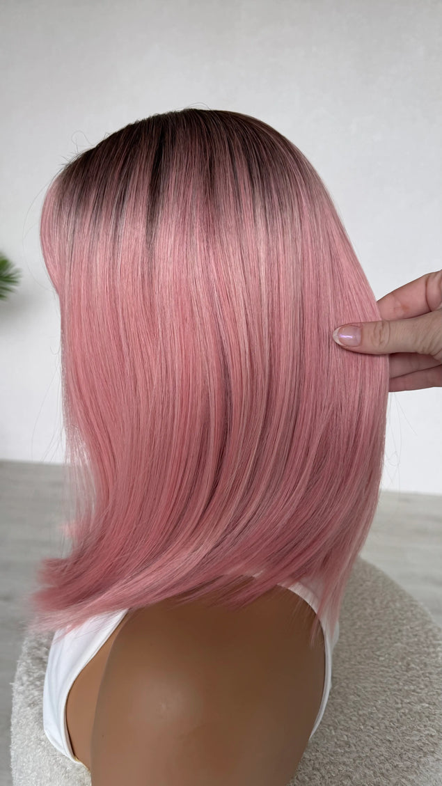 glueless heat safe synthetic topper, ombre pink hair with darker root and middle part.