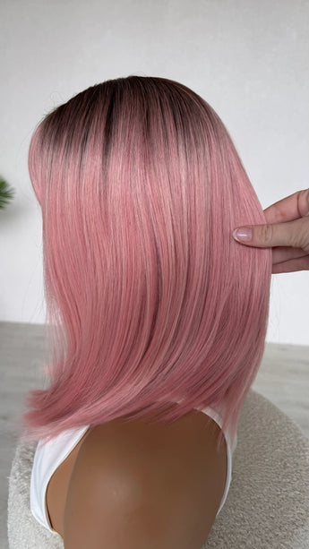 glueless heat safe synthetic topper, ombre pink hair with darker root and middle part.