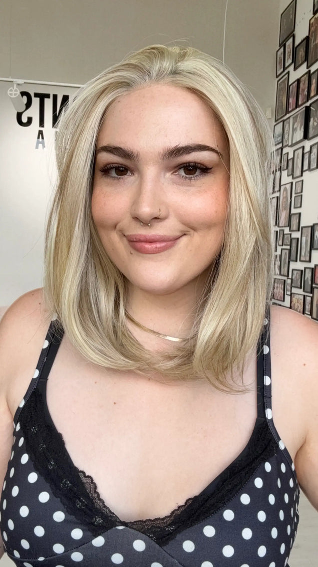 glueless petite synthetic wig for hairloss, hair parted to the side, buttery blonde long bob length.
