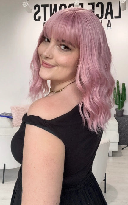 Heat safe pink hair wig with fringe, wavy hair styling, glueless synthetic pink wig australia. natrual synthetic wigs.