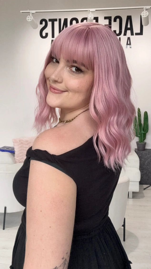 Heat safe pink hair wig with fringe, wavy hair styling, glueless synthetic pink wig australia. natrual synthetic wigs.