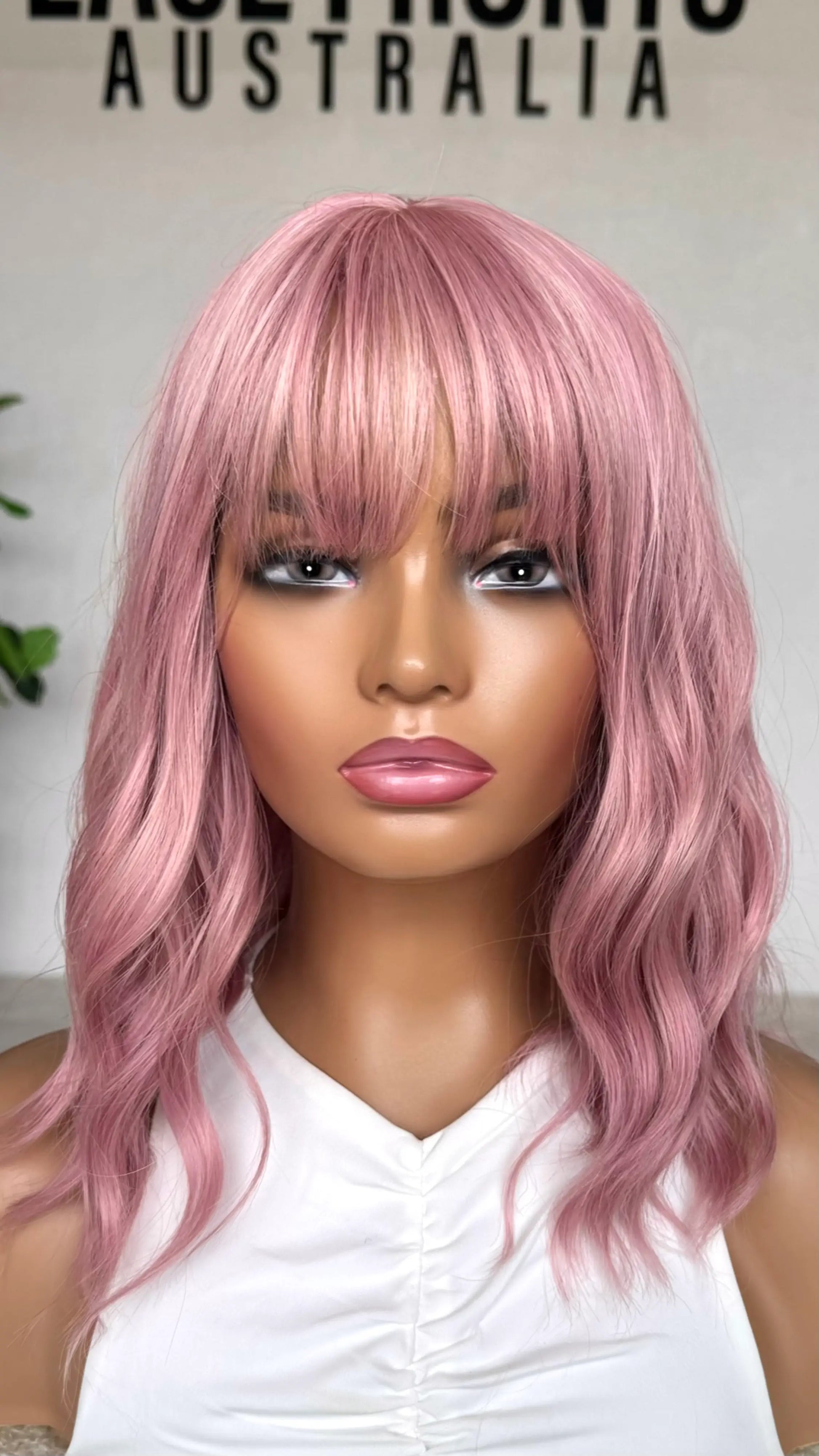 Pearl Pink Wavy Fringe Synthetic - Cotton Candy front view. heat safe synthetic.