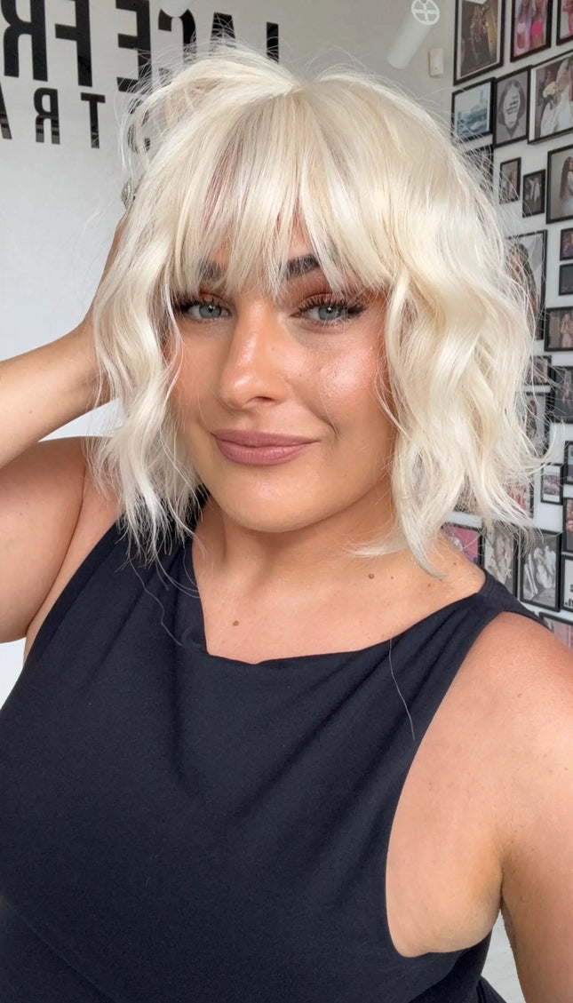 synthetic fringe wig platinum white blonde, wavy 10 inch bob.