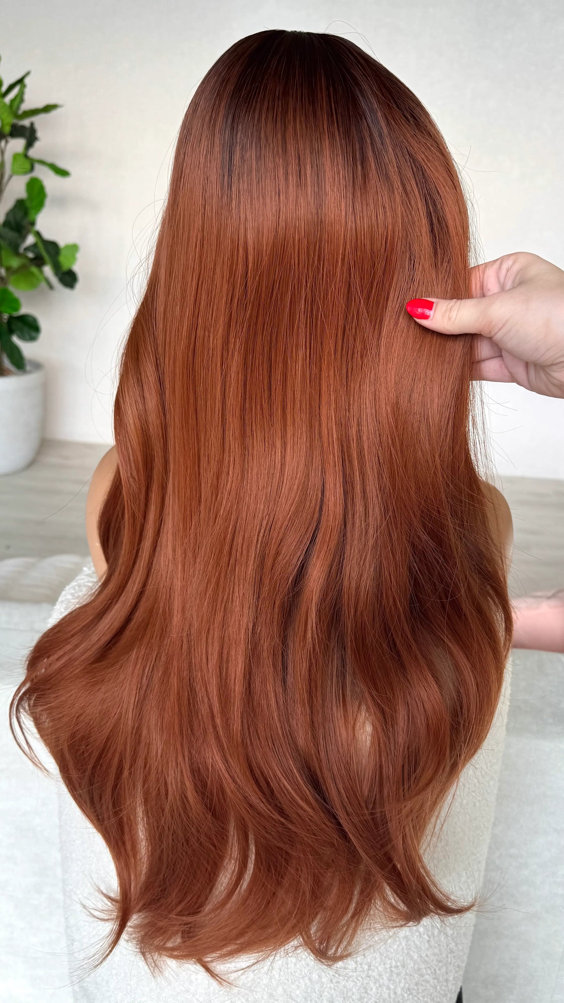 copper synthetic wig from the back, showing hair colour with dark root, long hair heat safe.
