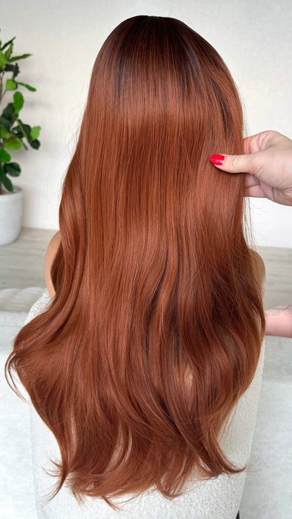 copper synthetic wig from the back, showing hair colour with dark root, long hair heat safe.