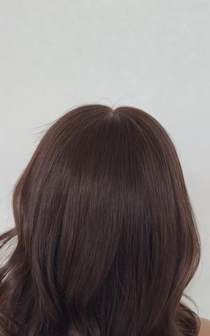 medical grade lace front human hair wig with dark brunette curled hair, gluless wig for everyday wear.