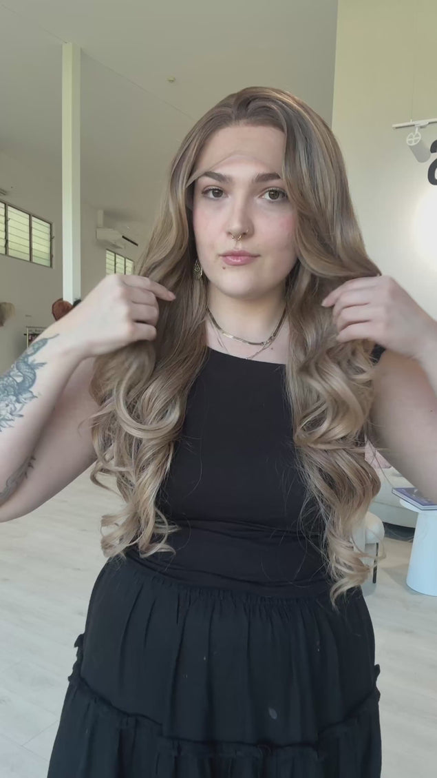 lace front long curly synthetic, heat safe, glueless wig cap with soft root to ombre brunette hair.