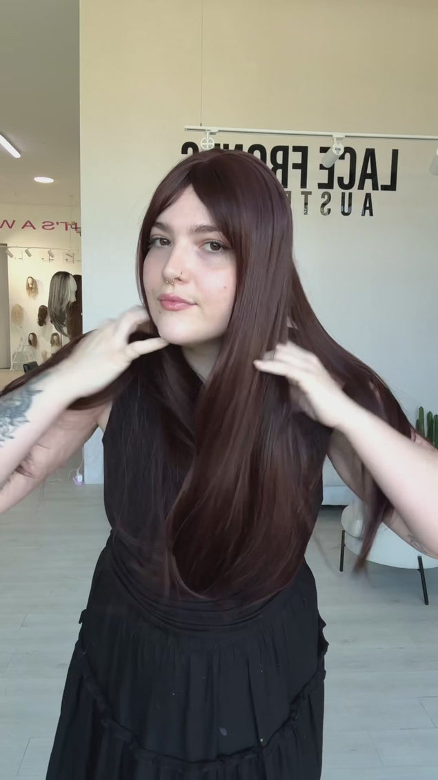 long length burgundy red hair synthetic wig with a glueless cap, long fringe and heat safe hair.
