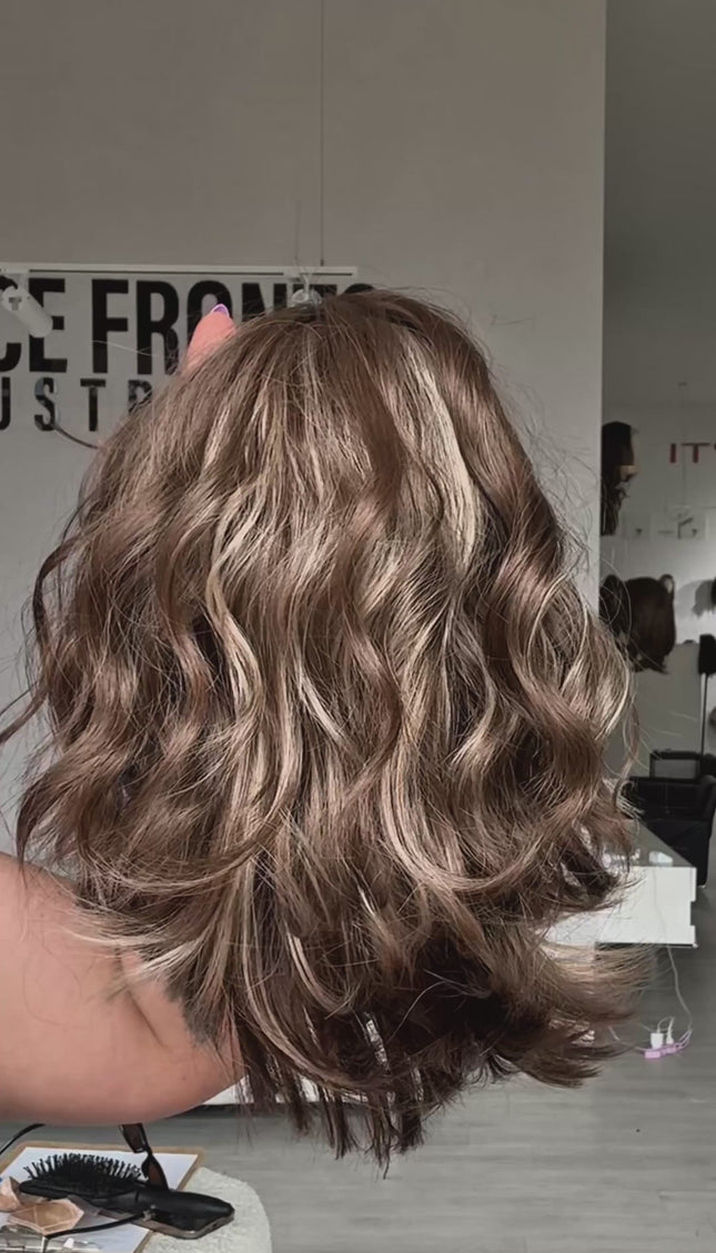 wavy short light brunette bob, light brunette colour with soft light blonde highlights throughout, short waby bob style with middle part and fringe. heat safe hair and glueless wig cap.