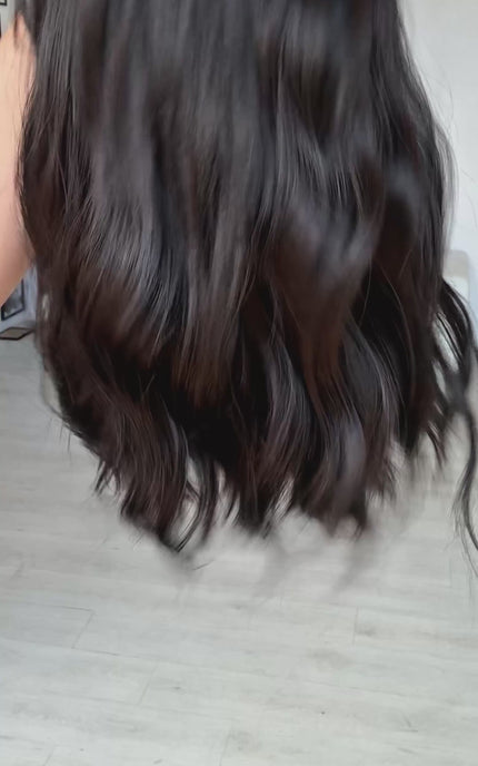 black wavy hair long bob wig, with a middle part and long fringe, heat safe black hair. glueless wig cap for easy everyday wear.