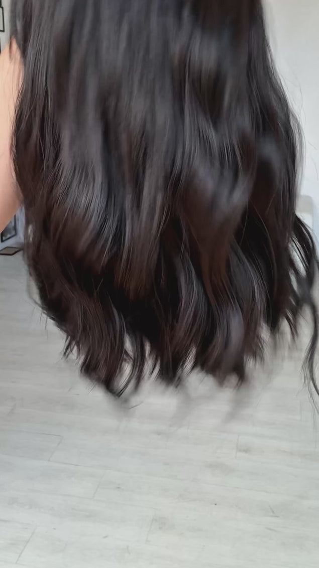 black wavy hair long bob wig, with a middle part and long fringe, heat safe black hair. glueless wig cap for easy everyday wear.