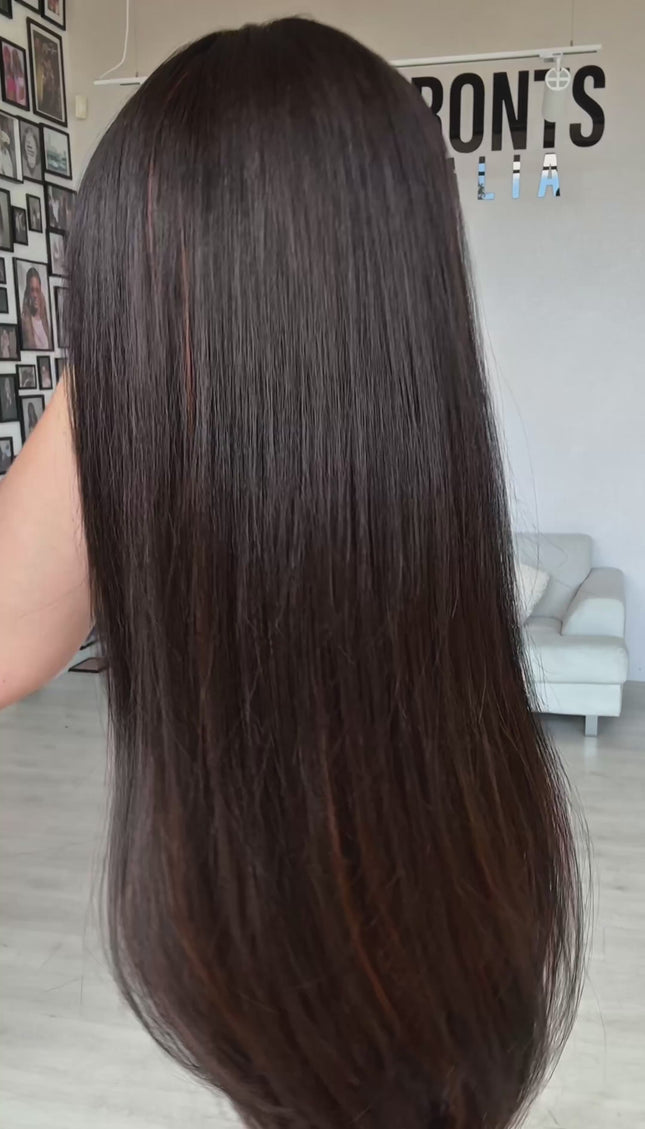 dark brunette with warm chestnut highlights on underside of hair. middle part with fringe, long straight hair, heat safe wig.