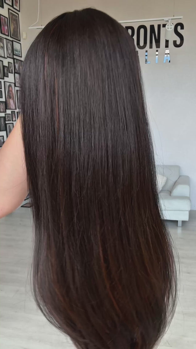 dark brunette with warm chestnut highlights on underside of hair. middle part with fringe, long straight hair, heat safe wig.