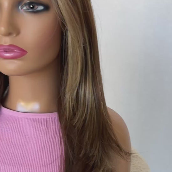 cinnamon brunette lacefront with highlights, side on view lacefront t-part. layered hair with long curtain bangs.