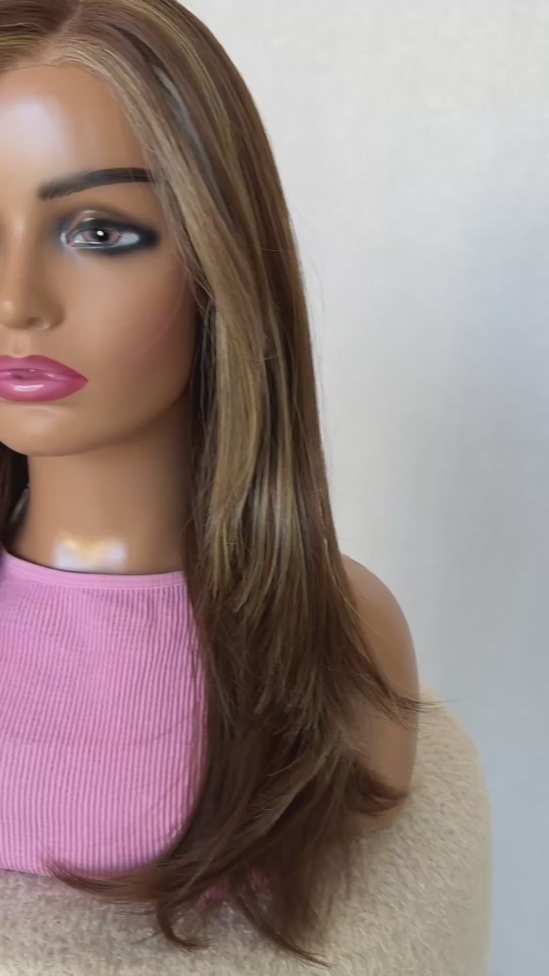 cinnamon brunette lacefront with highlights, side on view lacefront t-part. layered hair with long curtain bangs.