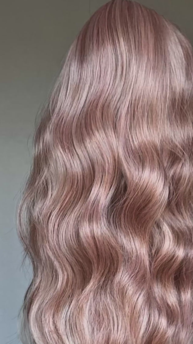 long hair, wavy pink with pearly finish. long length wavy hair with heat safe fibres, middle part with long fringe, glueless wig cap for easy daily wear. long length pink hair.