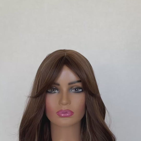 ginger snap. lone fringe wig synthetic, middle part, long fringe parted to the side