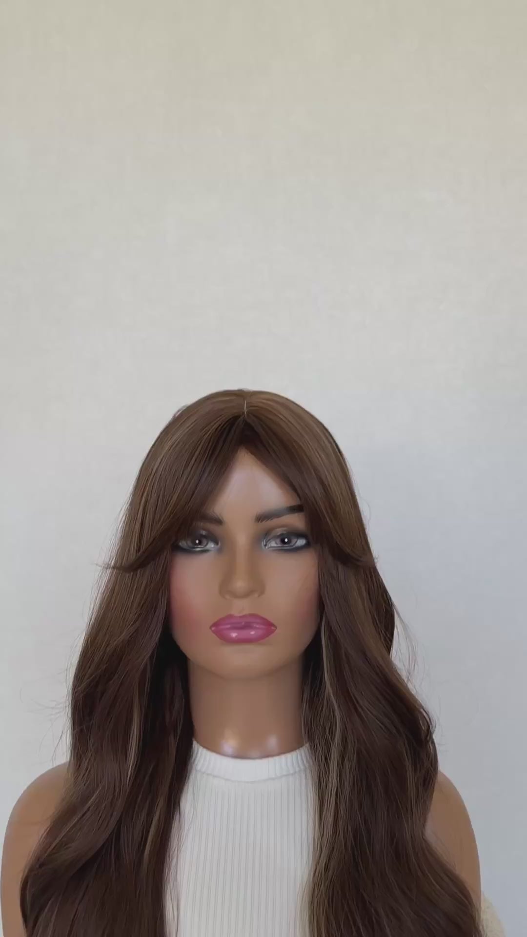 ginger snap. lone fringe wig synthetic, middle part, long fringe parted to the side