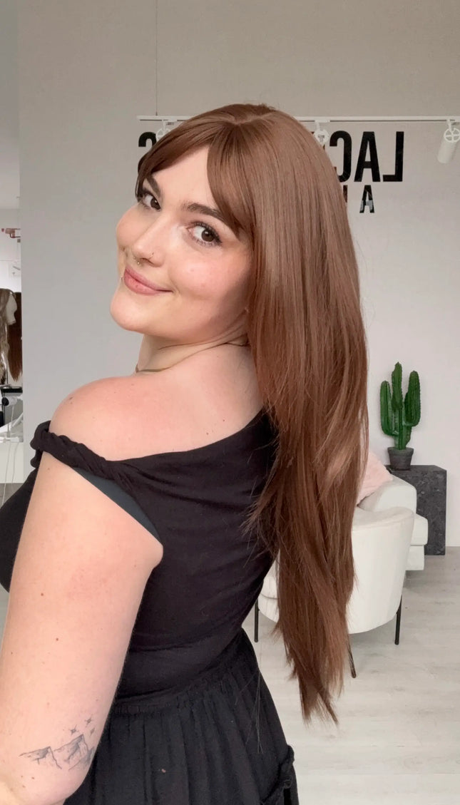 natural looking long hair synthetic wig with heat safe hair and a glueless cap.