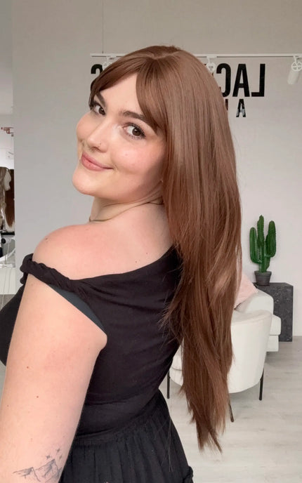 natural looking long hair synthetic wig with heat safe hair and a glueless cap.
