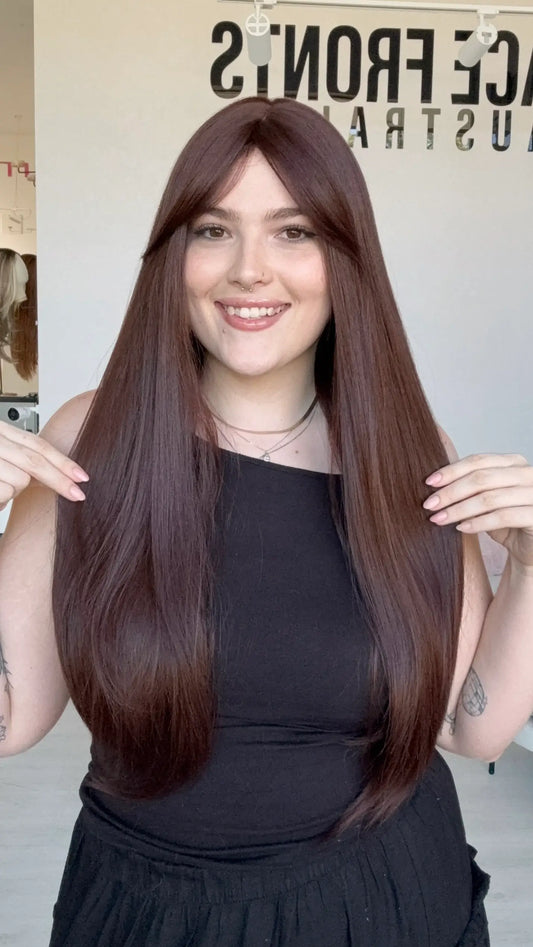 glueless synthetic deep red brown long fring wig with middle part.