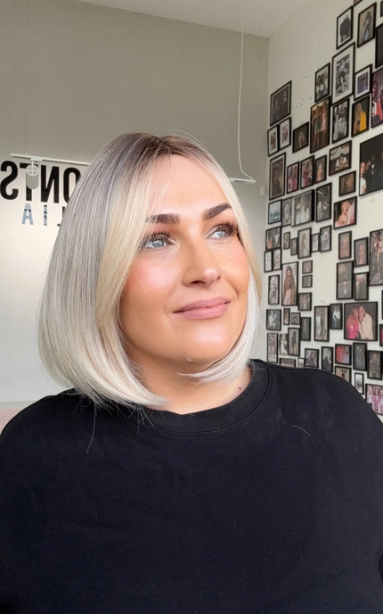 glueless 12 inch bob synthetic wig, gold coast australia, darker root with long fringe parted to side.