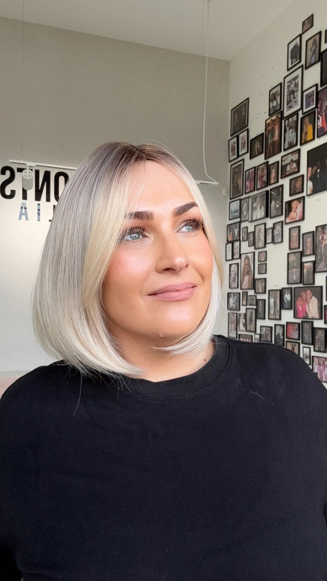 glueless 12 inch bob synthetic wig, gold coast australia, darker root with long fringe parted to side.